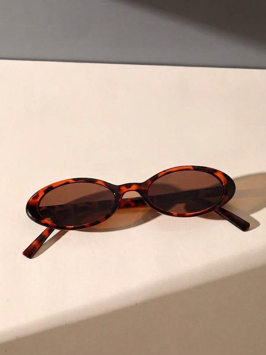 Brown Cat Eye Sunglasses Featuring A Glossy Tortoiseshell Plastic Frame And Tinted Brown Lenses
